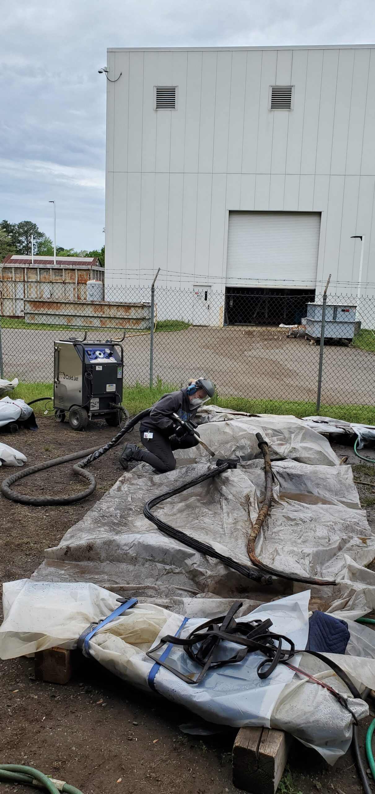 Assistant Archaeological Conservator Olivia Haslam dry ice blasting a few of Monitor’s objects.