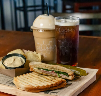 Two iced coffees and a panni with chips and dipping sauce, all from Column 15 at The Mariners' Café.