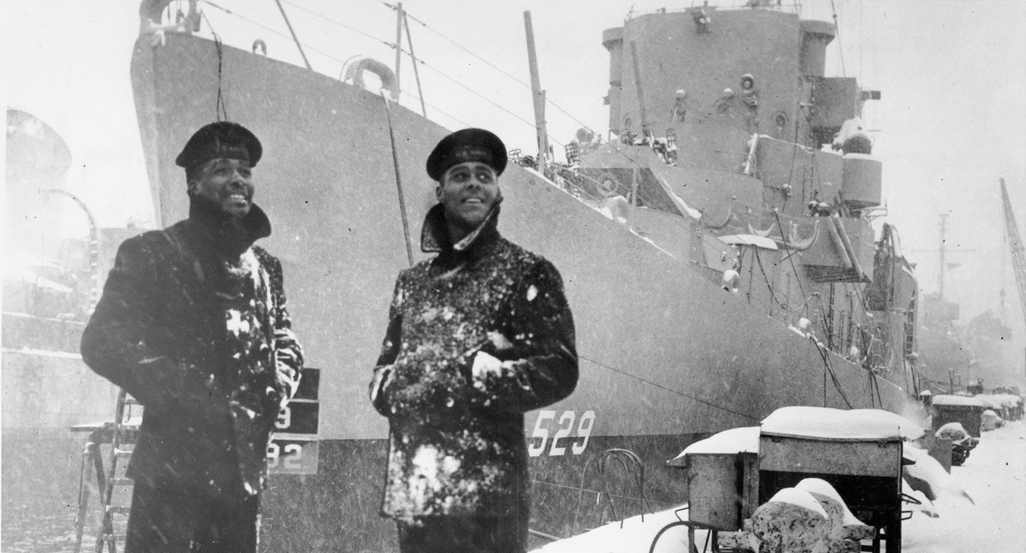 Two African American Sailors Stand in Front of USS Mason (Destroyer escort: DE-529)