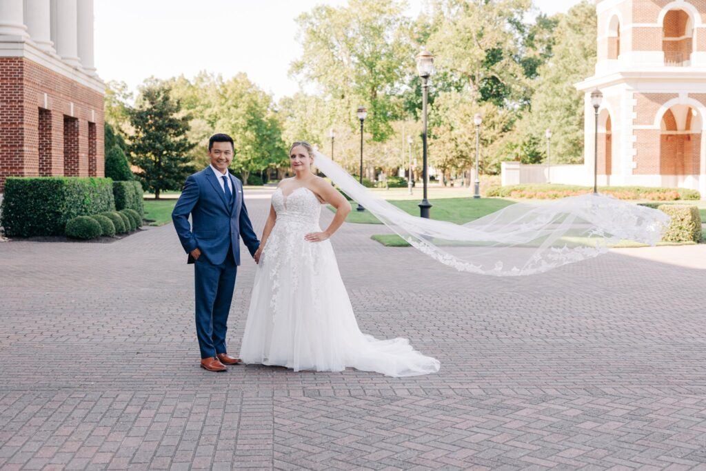 Bride and groom holding hands.