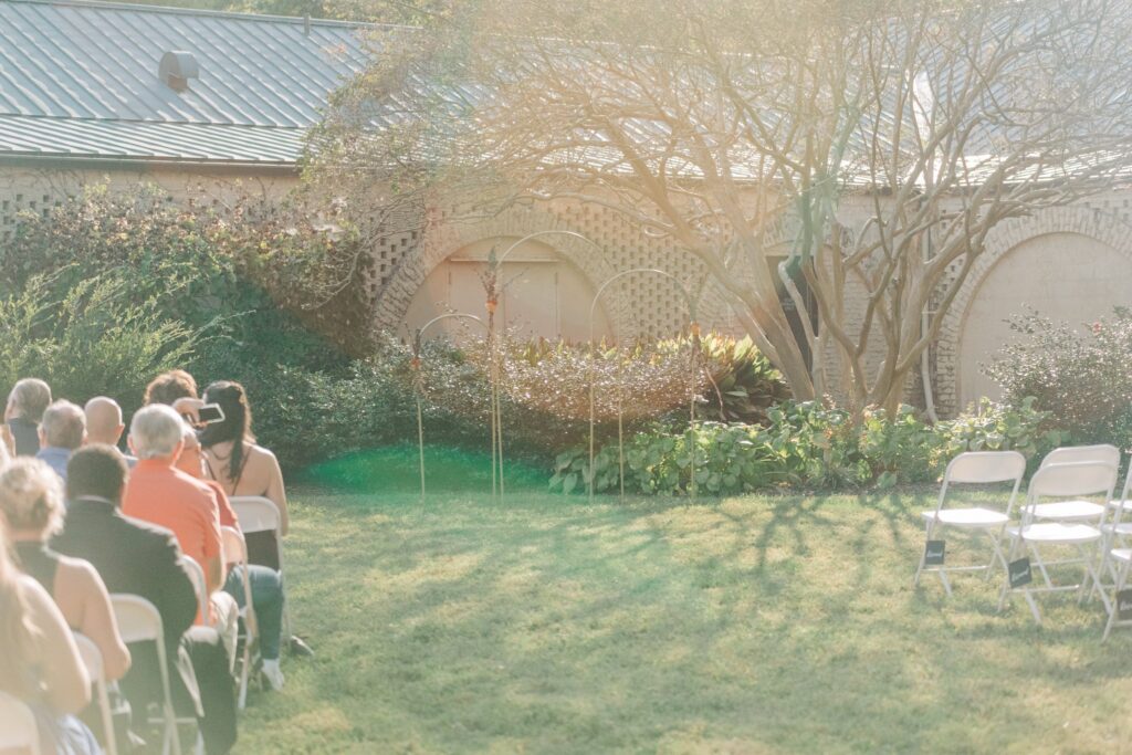 Photo of the outside wedding altar and guests in their seats.
