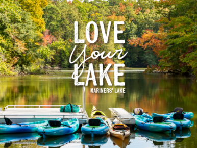 Kayaks in lake with text saying Love your Lake